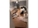 Living room featuring wood flooring and fixtures in need of renovation at 457 Rockborough Ter, Stone Mountain, GA 30083