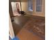 Living room showcases natural light, and requires new flooring at 457 Rockborough Ter, Stone Mountain, GA 30083