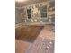Large room with nice window exposure getting remodeled with wood flooring at 457 Rockborough Ter, Stone Mountain, GA 30083
