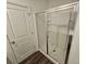 Bathroom featuring a glass enclosed shower and vinyl wood flooring at 656 Friesland Dr, Hampton, GA 30228