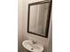 Small bathroom with a sink, mirror and silver fixtures at 656 Friesland Dr, Hampton, GA 30228