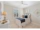 This bedroom features a bed, bedside table and shiplap accent wall at 7165 Cordery Rd, Cumming, GA 30040