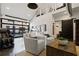 Bright living room with modern design elements, glass doors, and comfortable seating with a kitchen view at 7165 Cordery Rd, Cumming, GA 30040