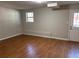 Finished basement with durable wood-look floors, recessed lighting, and exterior door at 1098 Westfield Se Trce, Smyrna, GA 30082