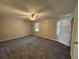 Spacious bedroom with soft carpet, ceiling fan, and lots of natural light at 1098 Westfield Se Trce, Smyrna, GA 30082