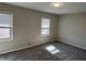 Neutral bedroom with carpet flooring, two windows, and a ceiling light at 1098 Westfield Se Trce, Smyrna, GA 30082