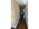Inviting hallway with dark hardwood floors leading to a bright living space with fireplace at 1098 Westfield Se Trce, Smyrna, GA 30082