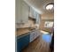Kitchen area boasts stainless steel dishwasher and sink, granite countertops, and hardwood floors at 1098 Westfield Se Trce, Smyrna, GA 30082