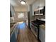 Updated kitchen featuring stainless steel appliances, granite countertops, and hardwood floors at 1098 Westfield Se Trce, Smyrna, GA 30082
