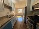 Stylish kitchen with granite countertops, stainless steel appliances, and a view to the dining area at 1098 Westfield Se Trce, Smyrna, GA 30082