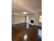 Bright living room with hardwood floors and a cozy fireplace at 1098 Westfield Se Trce, Smyrna, GA 30082