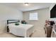 Cozy bedroom features a plush carpet, a window, and a TV at 1229 Church St # C, Decatur, GA 30030