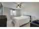 Well-lit bedroom features carpet, a window, and a ceiling fan at 1229 Church St # C, Decatur, GA 30030