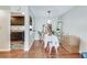 Inviting dining room featuring hardwood floors and an adjacent kitchen at 1229 Church St # C, Decatur, GA 30030