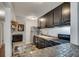 Modern kitchen featuring dark cabinets, tiled backsplash, and stainless steel appliances at 1229 Church St # C, Decatur, GA 30030