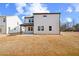 Back exterior of home with small patio and ample backyard at 148 Henley St, Canton, GA 30114