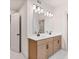 Bright bathroom featuring a double sink vanity, modern lighting, and a large mirror at 148 Henley St, Canton, GA 30114