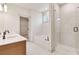 Bright bathroom features a soaking tub, glass enclosed shower, and modern fixtures at 148 Henley St, Canton, GA 30114