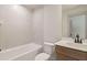 Bathroom showcasing a bathtub, tiled wall, vanity with a mirror and toilet at 148 Henley St, Canton, GA 30114