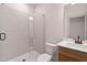 Modern bathroom featuring a glass shower, a sleek vanity, and contemporary fixtures at 148 Henley St, Canton, GA 30114