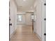 Hallway with hardwood floors and natural lighting at 148 Henley St, Canton, GA 30114