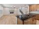 Open kitchen with a view of the living room, marble fireplace, and stairway at 148 Henley St, Canton, GA 30114