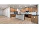 Modern kitchen featuring an island, stainless steel appliances, and wood-look floors at 148 Henley St, Canton, GA 30114