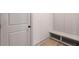 Mudroom featuring built-in bench and coat rack for organization at 148 Henley St, Canton, GA 30114