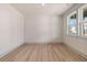 Unfurnished room featuring ample natural light from a large window at 148 Henley St, Canton, GA 30114