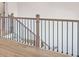 Staircase with stained wood railing and metal balusters at 148 Henley St, Canton, GA 30114