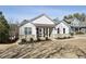 Inviting single-Gathering home with covered porch and beautifully landscaped front yard at 23 Knollwood Nw Way, Cartersville, GA 30121