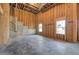 Spacious unfinished basement, showcasing the framing, concrete stairs, and natural light from the windows at 30 Grand Georgian Ne Ct, Cartersville, GA 30121