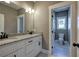 Bathroom with double granite vanity and a view into the toilet room, designed for convenience at 30 Grand Georgian Ne Ct, Cartersville, GA 30121