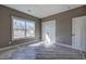 Bedroom featuring a large window, closet, and modern trim, offering a serene space at 30 Grand Georgian Ne Ct, Cartersville, GA 30121