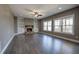 Spacious living room featuring a stone fireplace, built-in shelves, and hardwood floors at 30 Grand Georgian Ne Ct, Cartersville, GA 30121