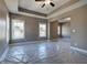 Main bedroom featuring tray ceiling, ceiling fan, carpet and ensuite bath access at 30 Grand Georgian Ne Ct, Cartersville, GA 30121