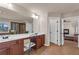 Spacious bathroom with double vanity, stylish fixtures, and a view into the living room at 4869 Locherby Dr, Fairburn, GA 30213