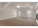 Spacious bedroom with neutral colors, recessed lighting, and tray ceiling at 4869 Locherby Dr, Fairburn, GA 30213