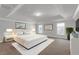 Large main bedroom featuring a tray ceiling, recessed lighting, and modern decor at 4869 Locherby Dr, Fairburn, GA 30213