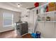 Well-organized laundry room with modern washer and dryer, shelving and ample storage space at 4869 Locherby Dr, Fairburn, GA 30213