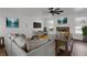 Cozy living room with a large sectional sofa, stone fireplace, and hardwood floors at 4869 Locherby Dr, Fairburn, GA 30213