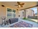 Covered patio featuring outdoor furniture, ceiling fan, and backyard view at 4869 Locherby Dr, Fairburn, GA 30213