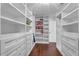 Spacious walk-in closet with white custom shelving and drawers offering lots of storage space at 4869 Locherby Dr, Fairburn, GA 30213