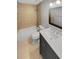 This bathroom offers a tiled tub, shower, and a black vanity with a white countertop at 1950 S Inlet, Marietta, GA 30066
