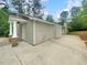 This property includes a stone foundation, a paved driveway, and an attached garage at 1950 S Inlet, Marietta, GA 30066