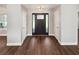 Bright and airy foyer with wood floors, modern lighting, and neutral walls, welcoming you inside the home at 1950 S Inlet, Marietta, GA 30066