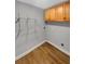 This laundry room boasts shelving and wood-look floors for convenience at 1950 S Inlet, Marietta, GA 30066