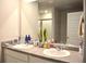 Well-lit bathroom showcasing a double sink vanity with modern fixtures at 2268 Redfern Rd, Dacula, GA 30019