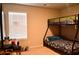 Comfortable bedroom featuring a bunk bed and a brightly lit window at 2268 Redfern Rd, Dacula, GA 30019