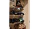 Image of a closet with metal racks, holding bags, clothing, hats and other items at 2268 Redfern Rd, Dacula, GA 30019
